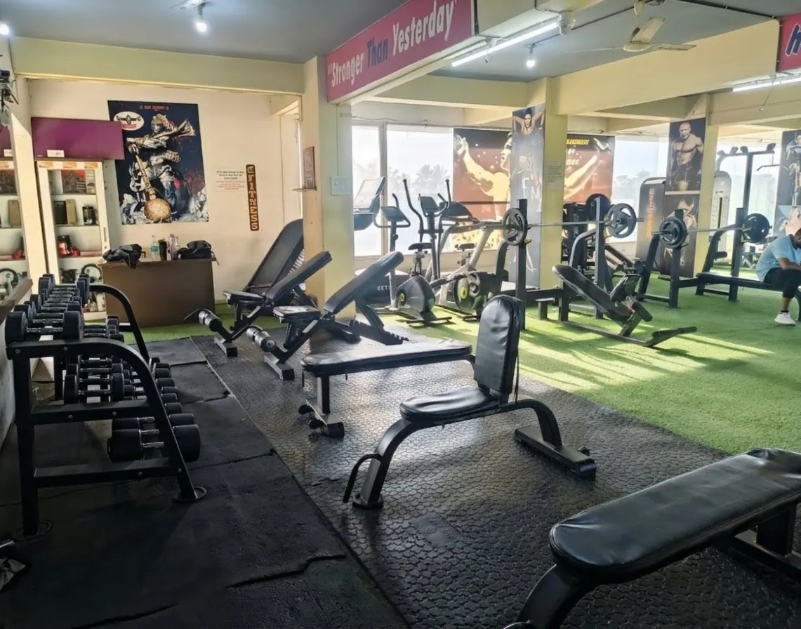 Three-tier dumbbell rack and free weights at Kesari Health Club Kopargaon